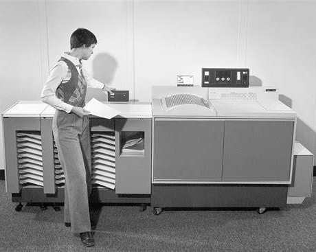 person standing at an original xerox fax machine